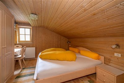 Bedroom of the attic flat of the Waldsamerhof